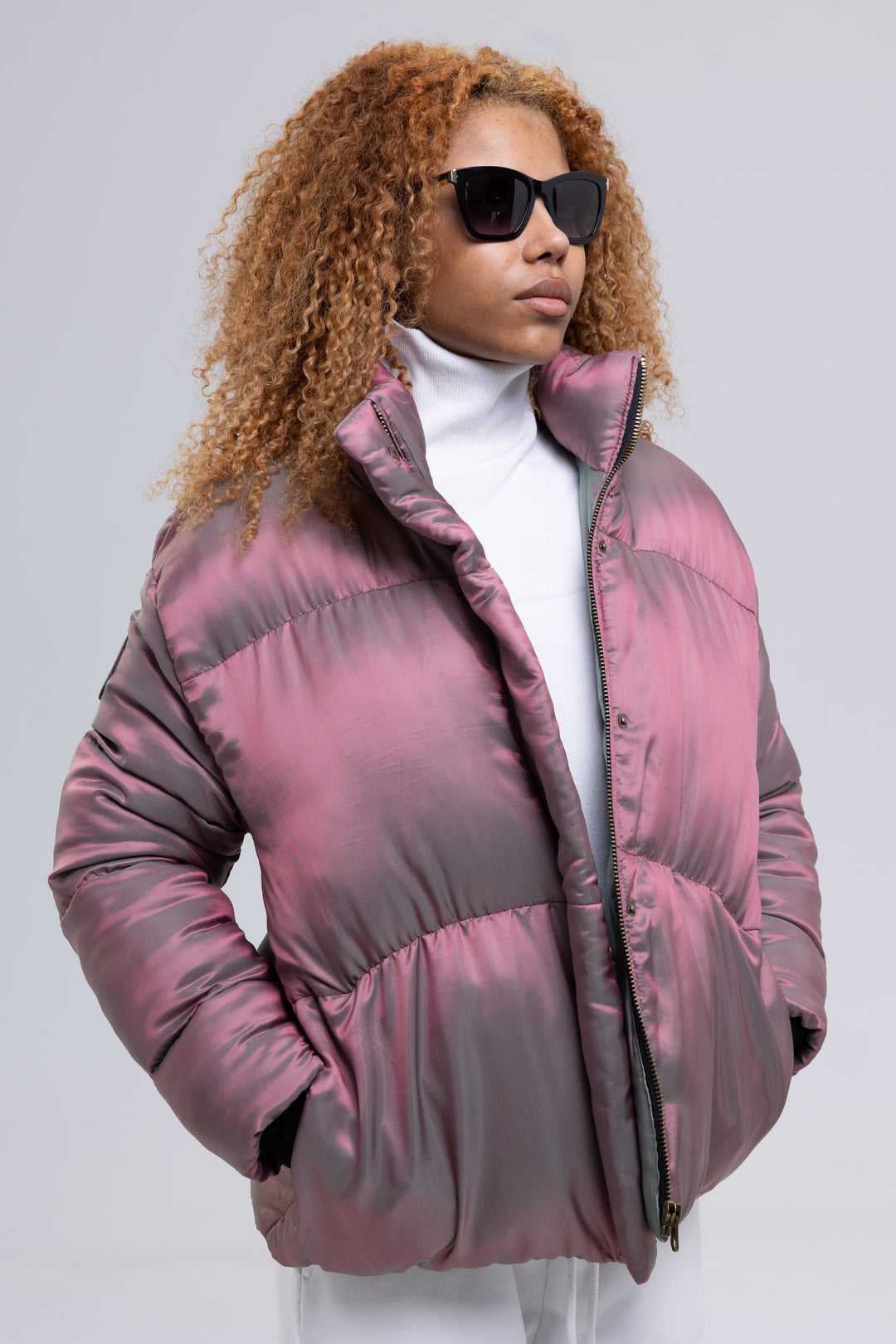 Pink puffer jacket for women with funnel neck, worn open over a white turtleneck - Baleni