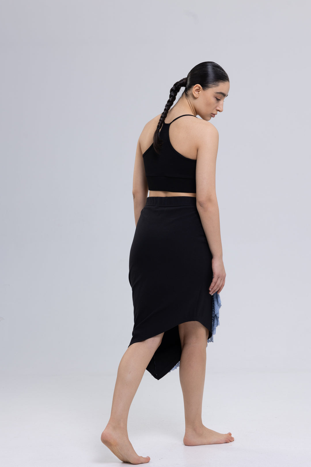 Asymmetrical skirt with lace ruffle hem