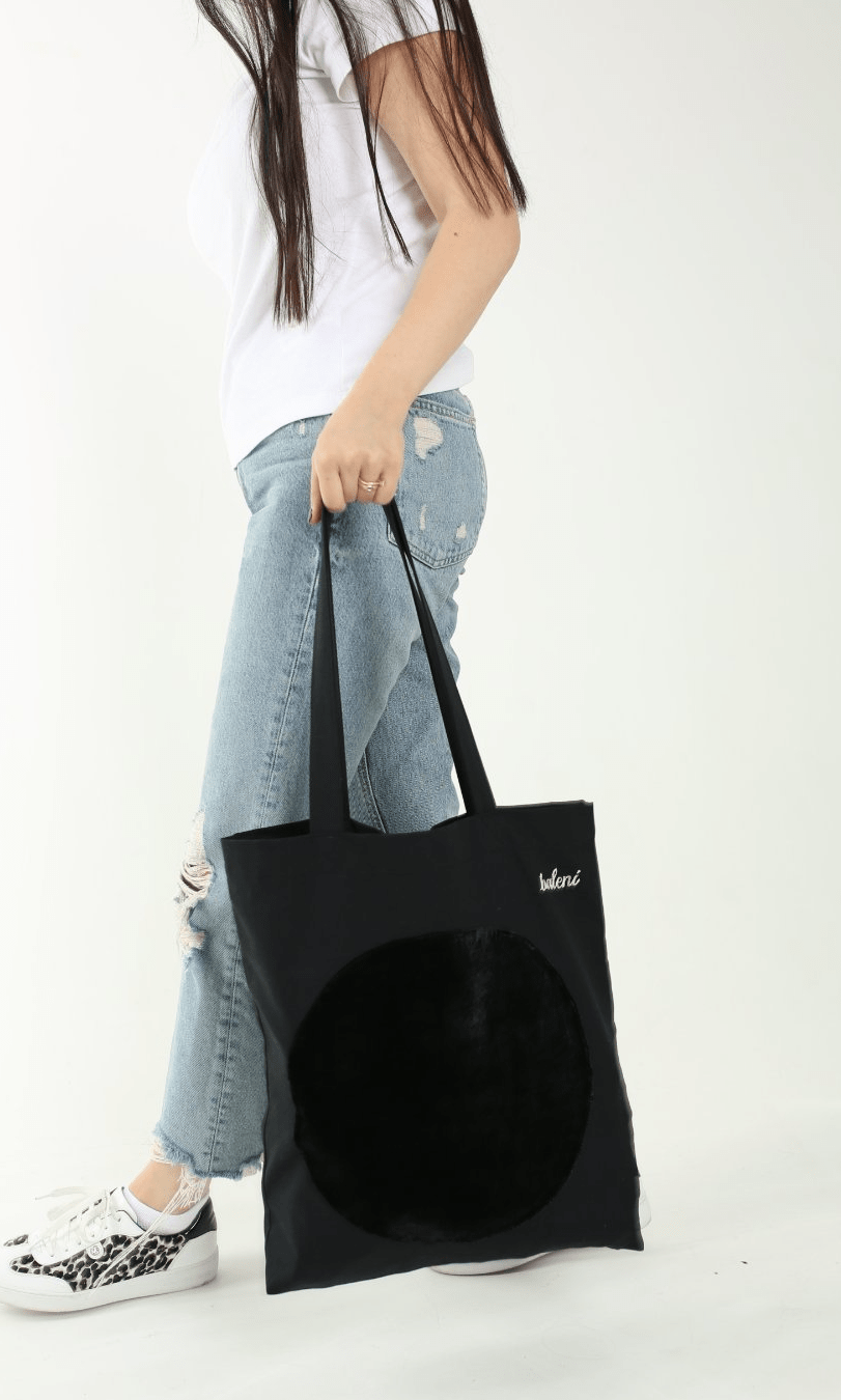 Black canvas tote bag with long straps