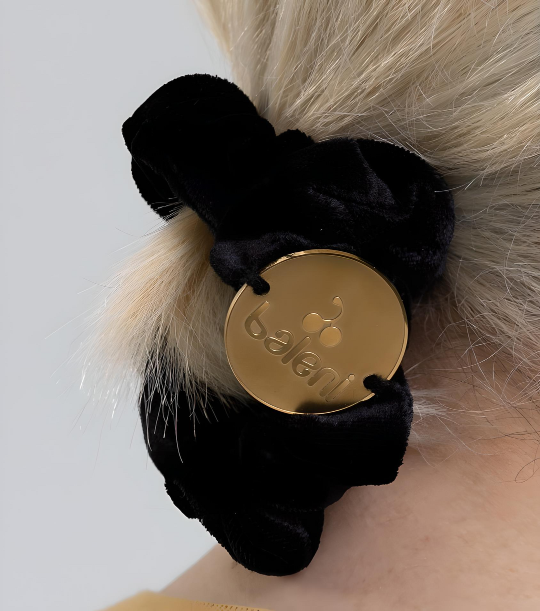 Black silk scrunchie with golden logo