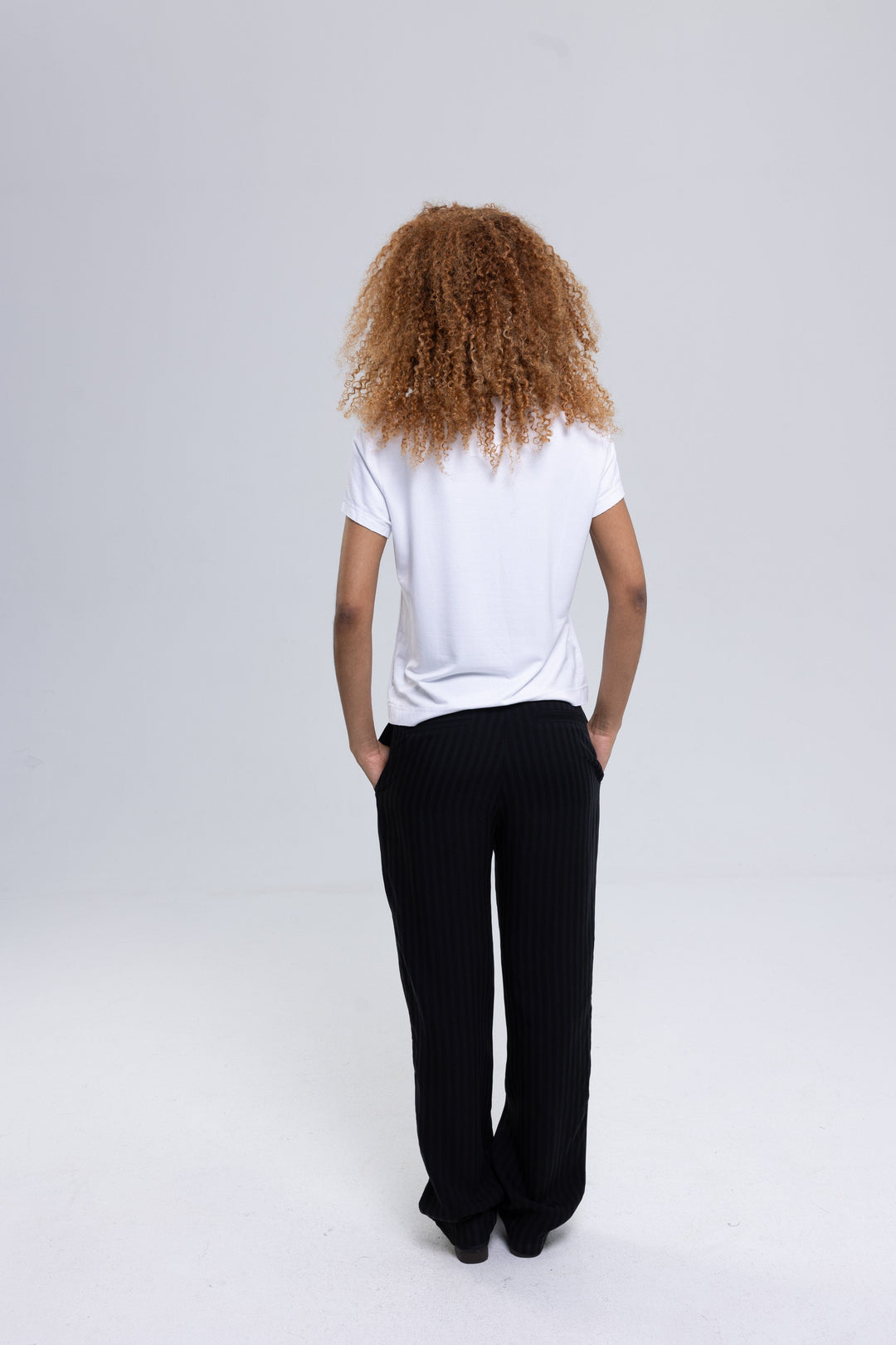Women's black striped straight-leg trousers by Baleni