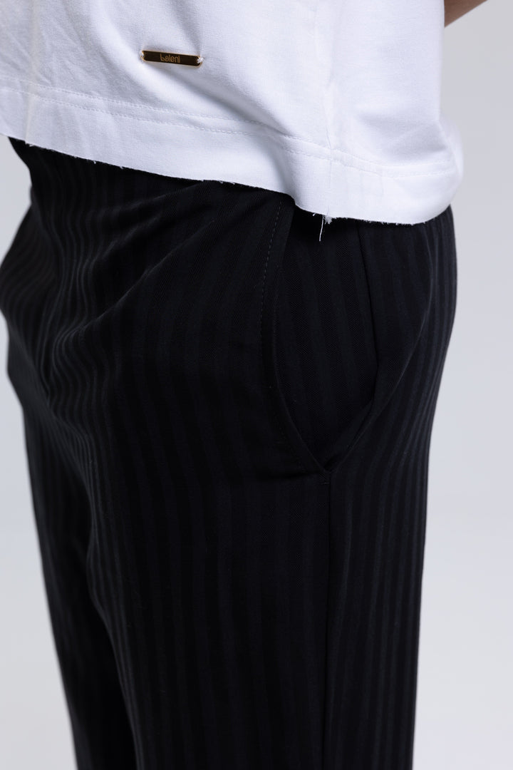 Tailored black striped trousers with cropped hem