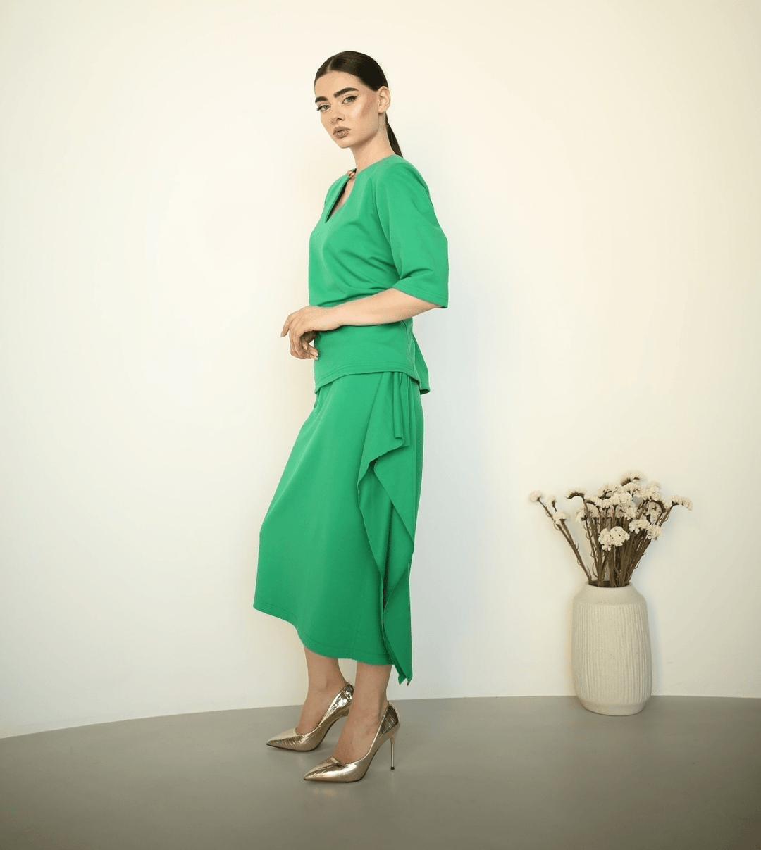 Green midi skirt with ruffled side trim