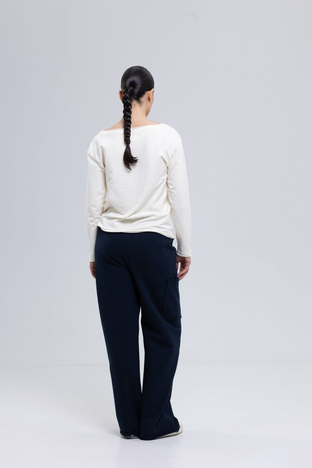 Navy cargo pants with raw-edged side pocket