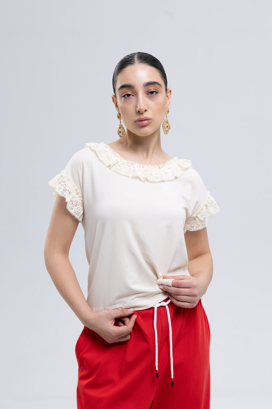 Off-white ruffle neck blouse with lace cap sleeves