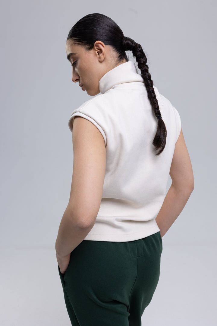 Peach sleeveless turtleneck