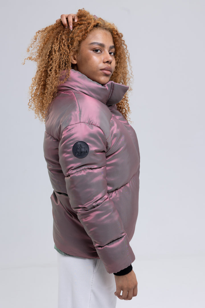 Side view of a pink puffer jacket with high funnel neck and leather logo patch on the sleeve - Baleni