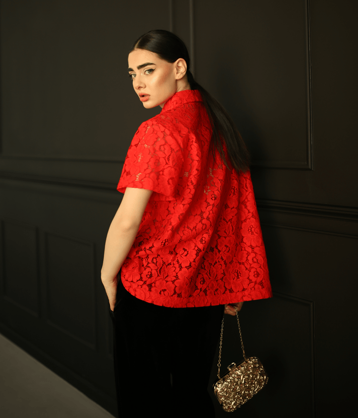Red lace top with short sleeves and boxy fit