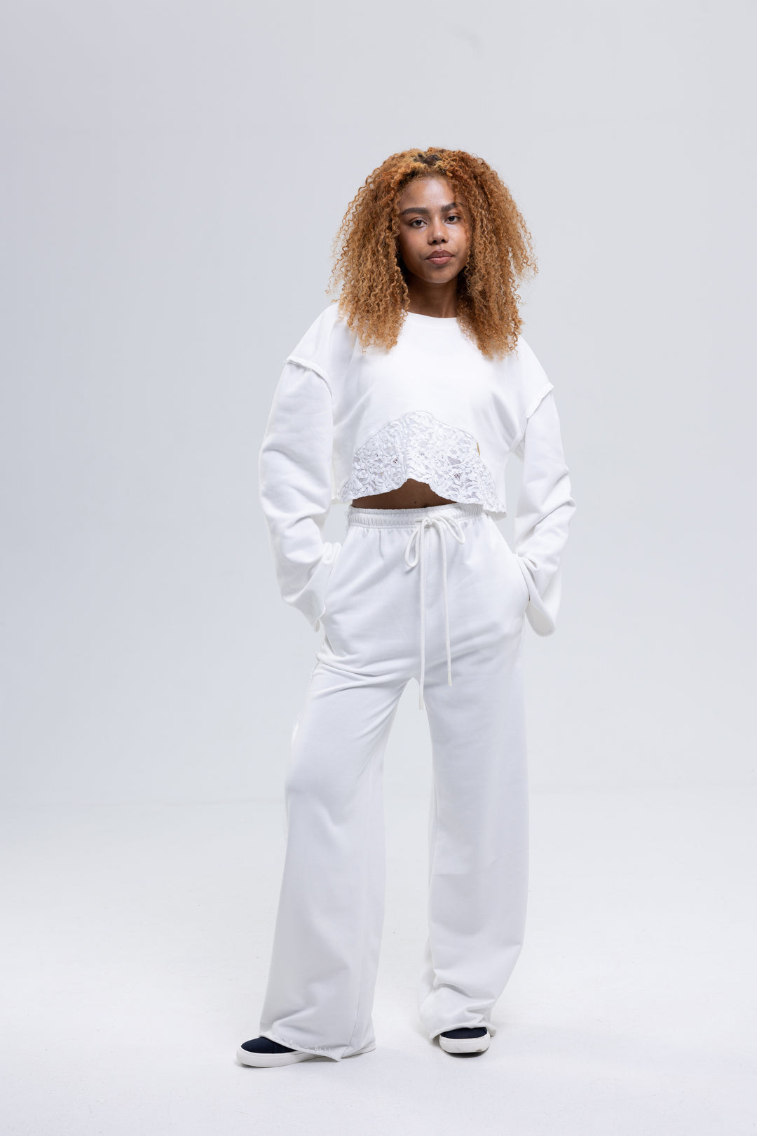White three-piece lounge set with lace and ruffle trim