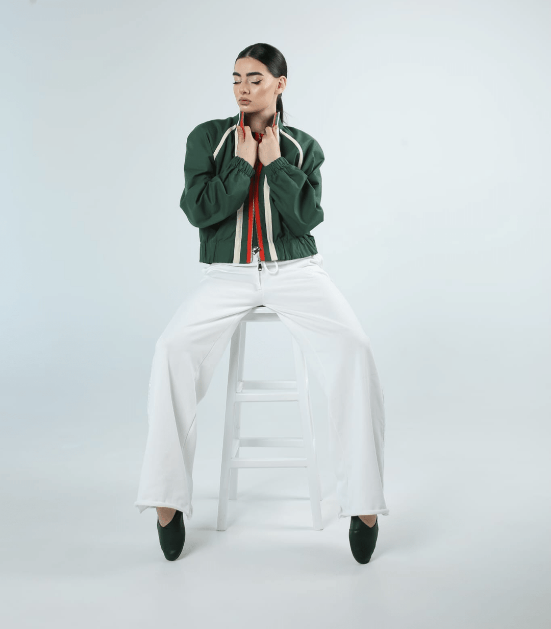 Women's green cropped bomber jacket styled with white wide-leg trousers, made in Armenia - Baleni