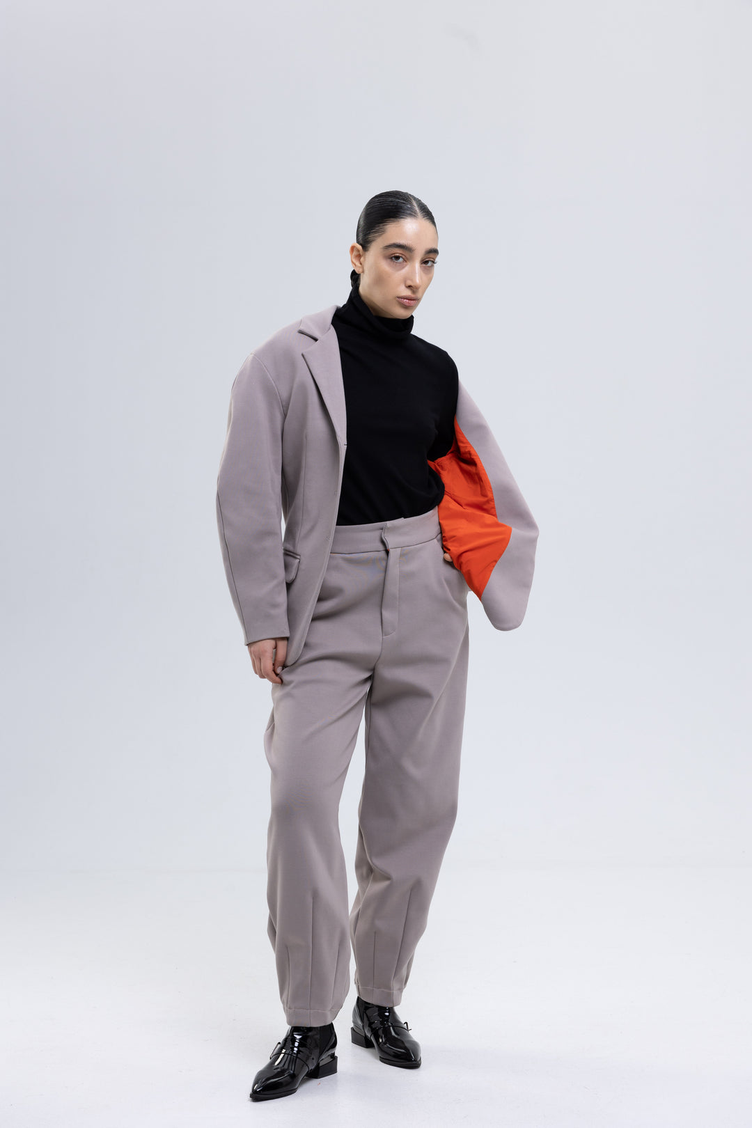 Women's mauve gray trouser suit with structured shoulders