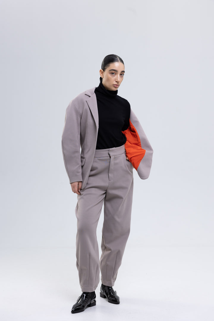 Women's mauve gray trouser suit with structured shoulders