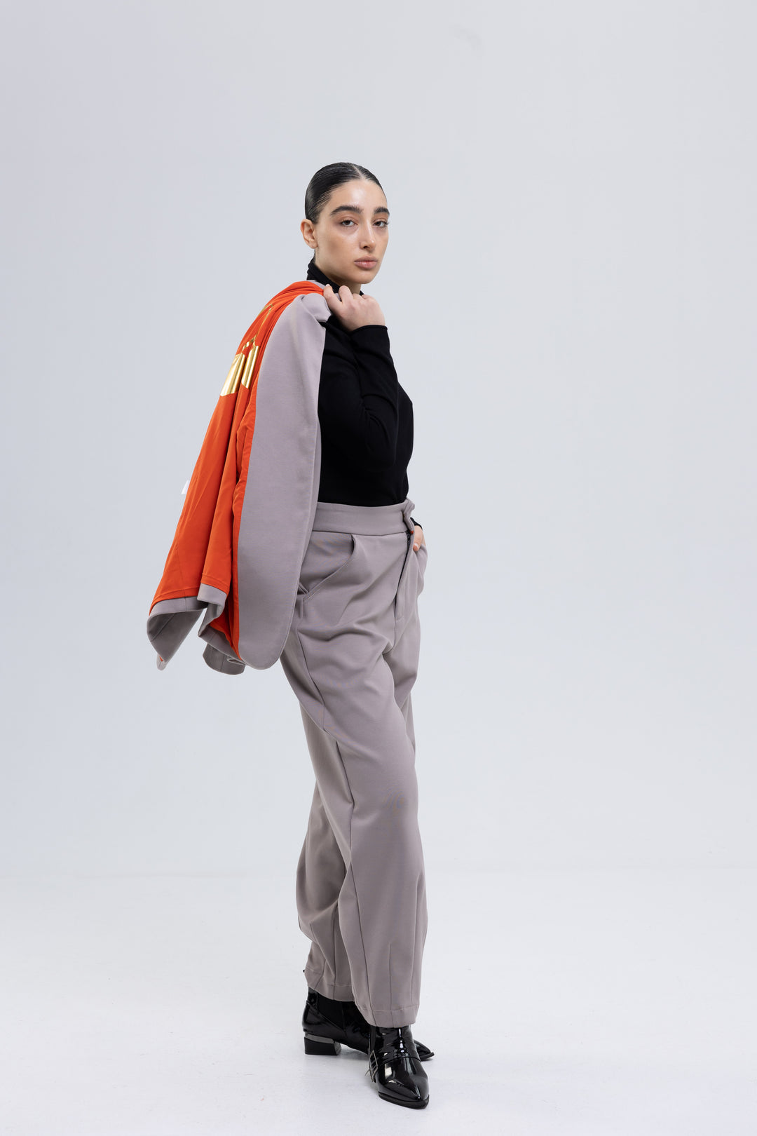 Mauve gray blazer with orange lining and tapered trousers